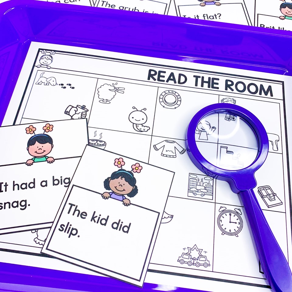 Read the room sentences on a purple tray with a magnifying glass spring science of reading literacy centers