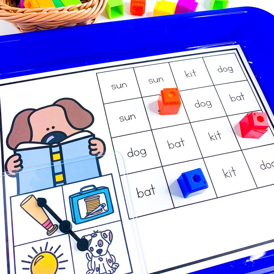 free science of reading literacy centers for back to school in kindergarten, first grade, or second grade - image shows CVC words spin and cover mat