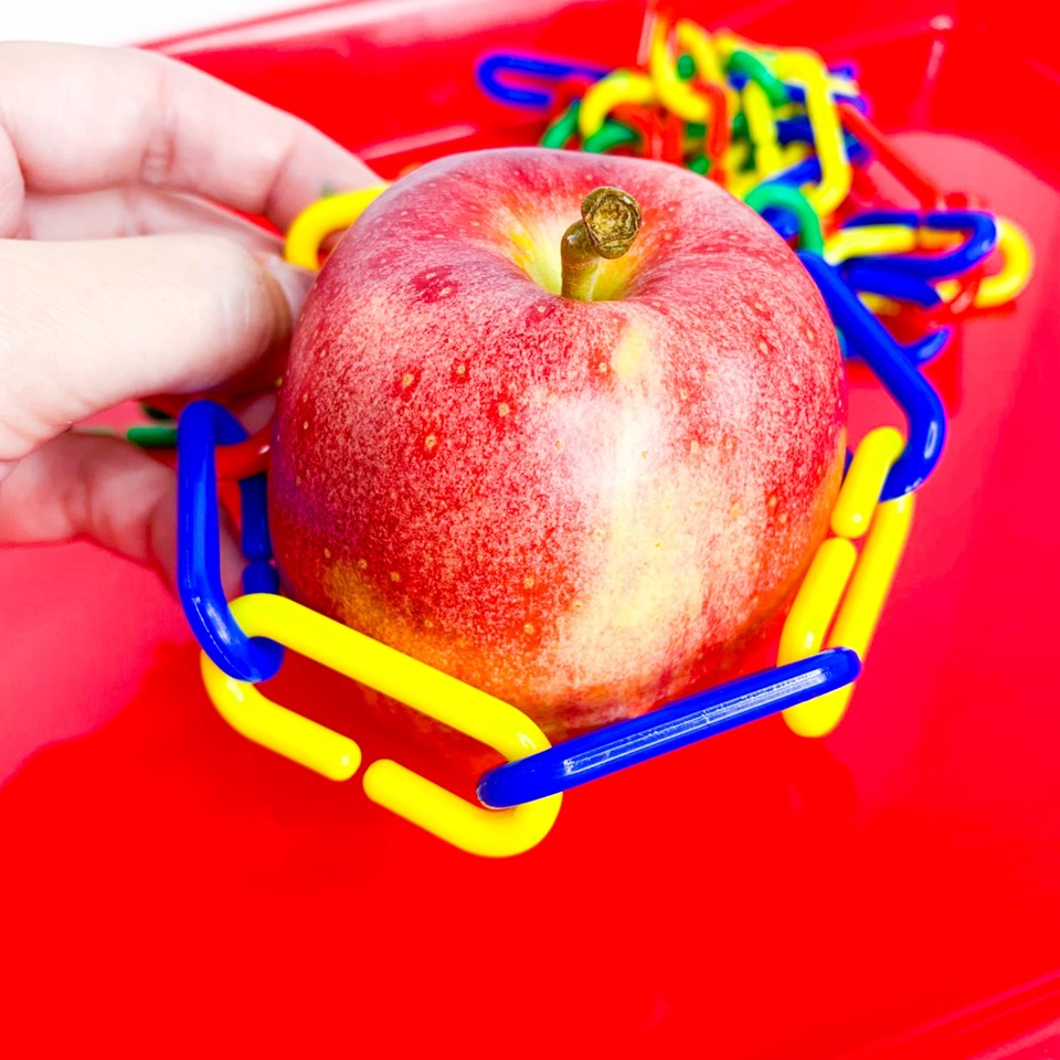 Measuring apple with plastic links