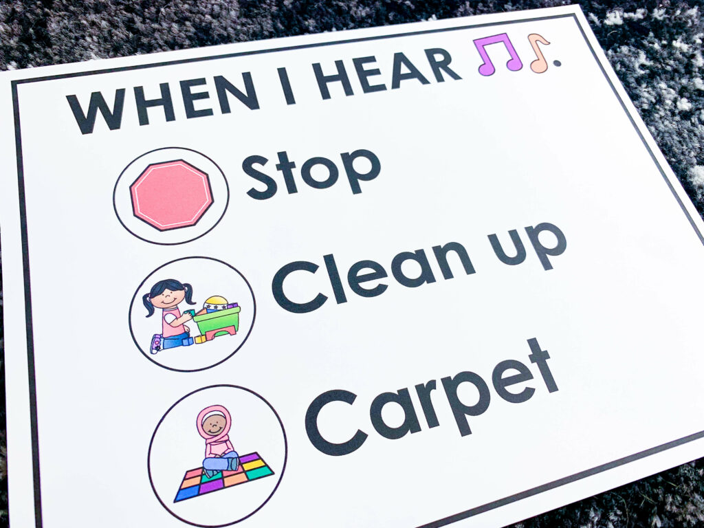 Classroom transitions | poster says "When I hear music, stop, clean up, carpet."