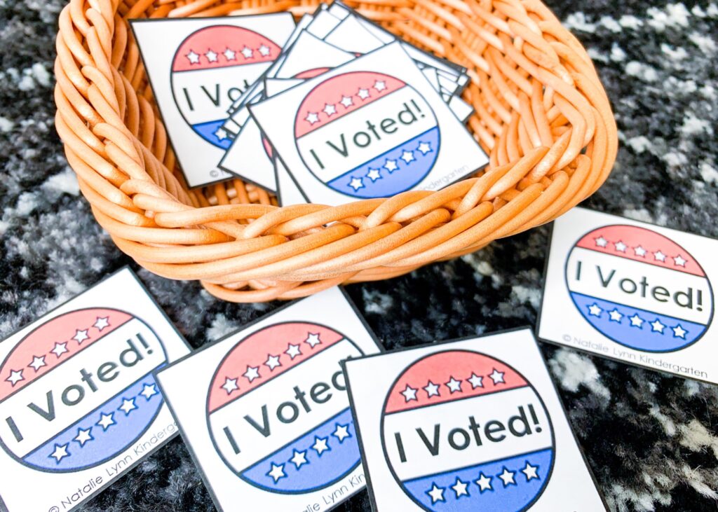 I voted stickers in a basket and spread out on a black and white carpet